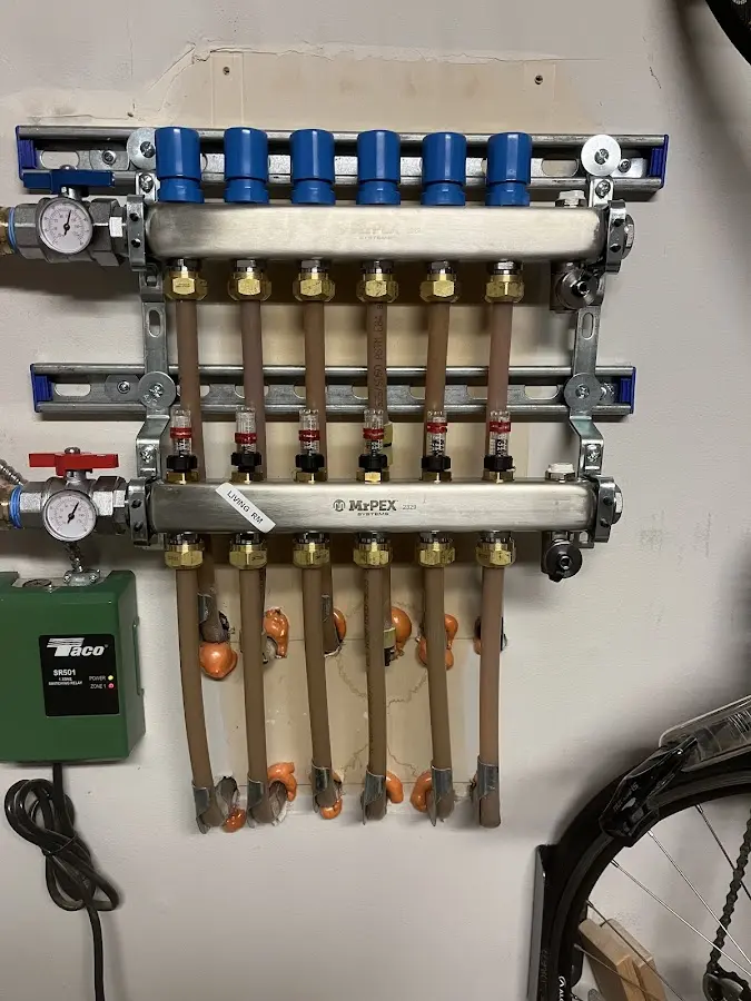 Plumber performing Water Heater Repair at a residential property in Geneva